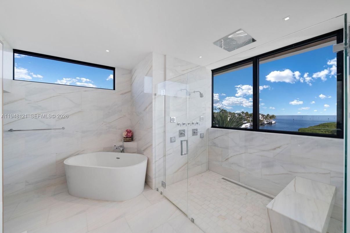 Bathroom, Free Standing Baths, Glass Shower, Interior, Marble, Marble Walls, Recessed Lighting, Water