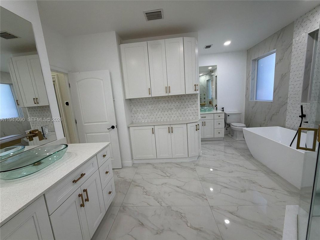 Bathroom, Dual Sink Vanities, Free Standing Baths, Interior, Marble, Marble Walls, Recessed Lighting