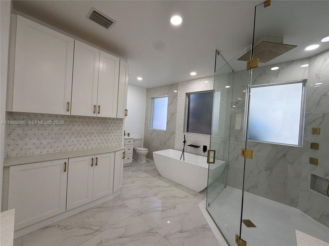 Bathroom, Free Standing Baths, Glass Shower, Interior, Marble, Marble Walls, Recessed Lighting