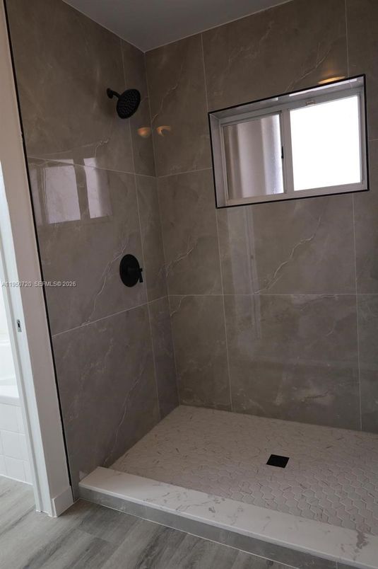 Bathroom, Glass Shower, Interior, Marble Walls, Wood Texture Flooring