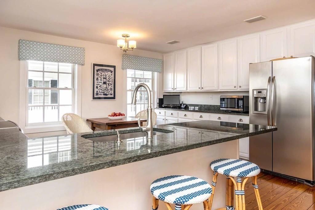 Chandelier, Dining room, Interior, Kitchen, Stainless Steel Appliances, Wood Texture Flooring