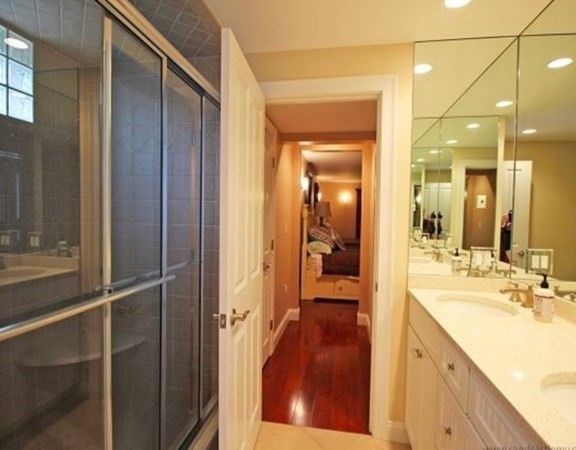Bathroom, Dual Sink Vanities, Glass Shower, Interior, Recessed Lighting, Wood Texture Flooring