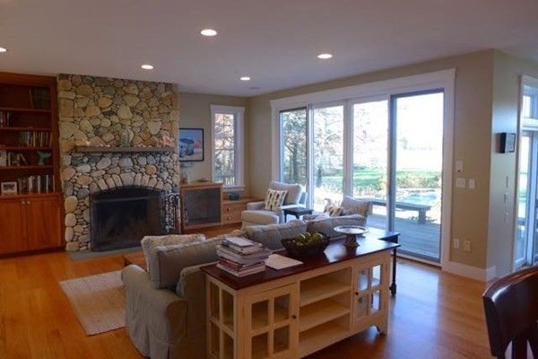 Fireplace, Interior, Living room, Recessed Lighting, Stone Walls, Wood Texture Flooring