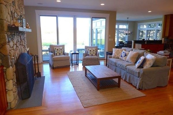 Chandelier, Dining room, Fireplace, Interior, Living room, Pendant Lights, Piano, Recessed Lighting, Stone Walls, Wood Texture Flooring