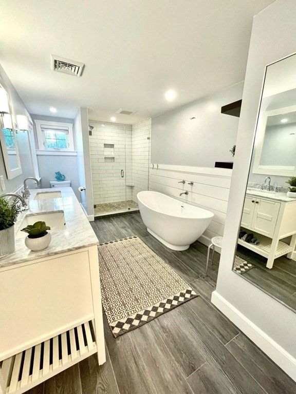 Bathroom, Dual Sink Vanities, Free Standing Baths, Glass Shower, Interior, Recessed Lighting, Wood Texture Flooring