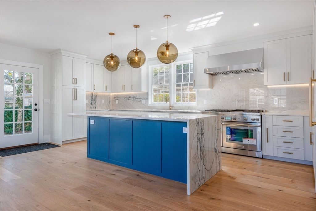 Interior, Kitchen, Marble Walls, Pendant Lights, Recessed Lighting, Stainless Steel Appliances, Wood Texture Flooring