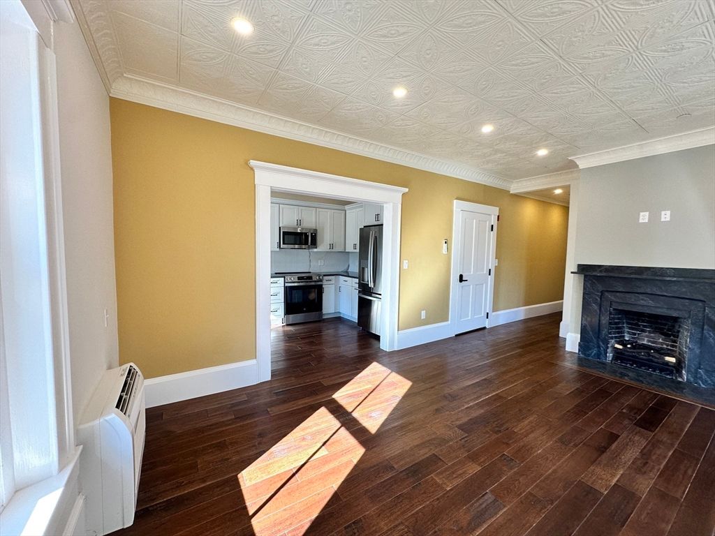 Empty room, Fireplace, Interior, Kitchen, Recessed Lighting, Wood Texture Flooring