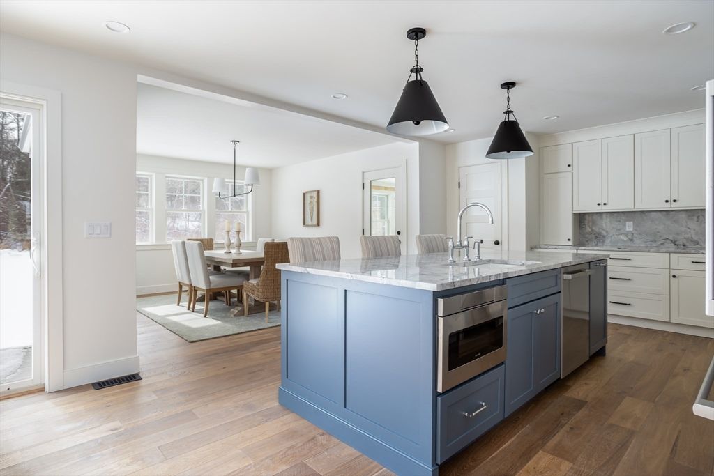 Dining room, Interior, Kitchen, Pendant Lights, Recessed Lighting, Stainless Steel Appliances, Wood Texture Flooring