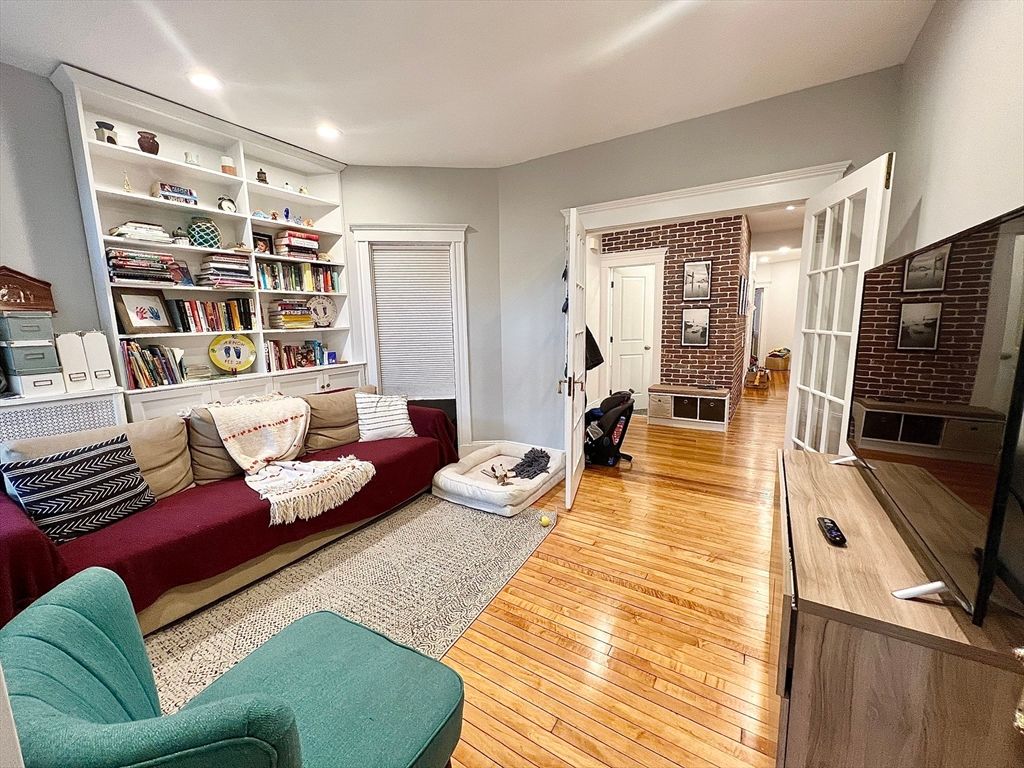 Fireplace, Interior, Living room, Recessed Lighting, Stone Walls, Wood Texture Flooring