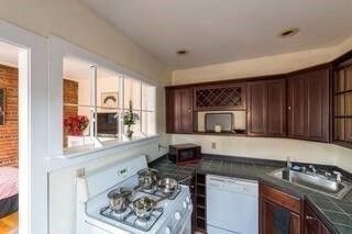 Interior, Kitchen, Recessed Lighting, Tile Countertops, Wood Texture Flooring