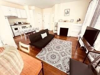 Dining room, Fireplace, Interior, Kitchen, Living room, Recessed Lighting, Stainless Steel Appliances, Wood Texture Flooring