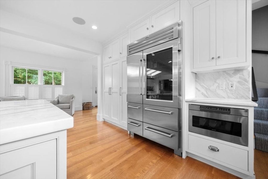 Interior, Kitchen, Marble Walls, Recessed Lighting, Stainless Steel Appliances, Wood Texture Flooring