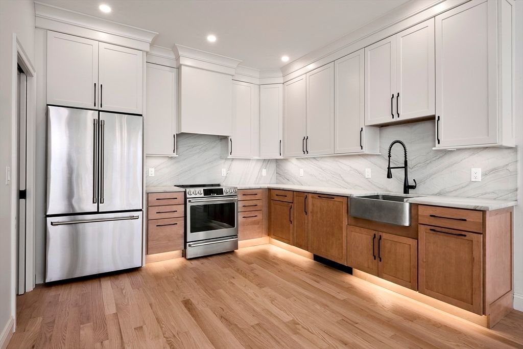 Interior, Kitchen, Marble Walls, Recessed Lighting, Stainless Steel Appliances, Wood Texture Flooring
