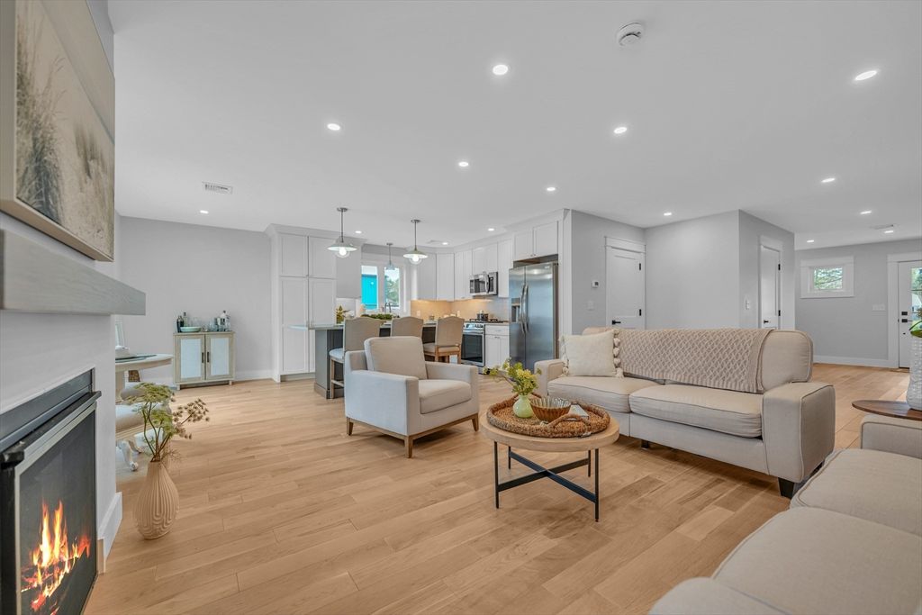 Dining room, Fireplace, Interior, Kitchen, Living room, Pendant Lights, Recessed Lighting, Stainless Steel Appliances, Wood Texture Flooring