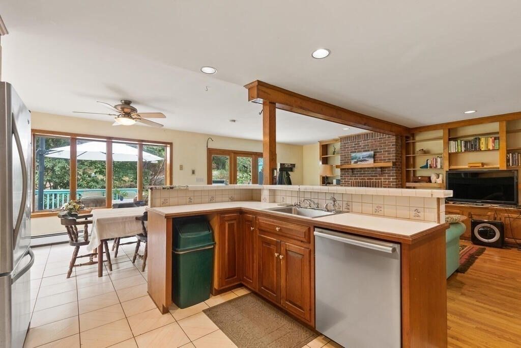 Dining room, Fireplace, Interior, Kitchen, Recessed Lighting, Stone Walls, Wood Texture Flooring