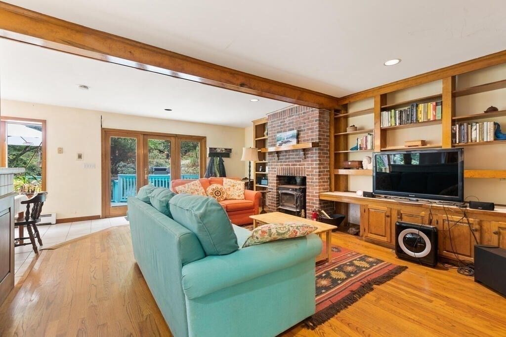 Fireplace, Interior, Living room, Recessed Lighting, Stone Walls, Wood Texture Flooring