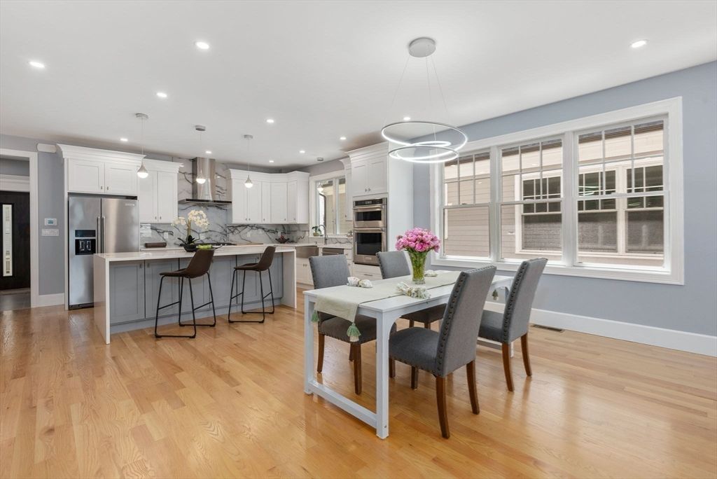 Dining room, Interior, Kitchen, Pendant Lights, Recessed Lighting, Stainless Steel Appliances, Wood Texture Flooring