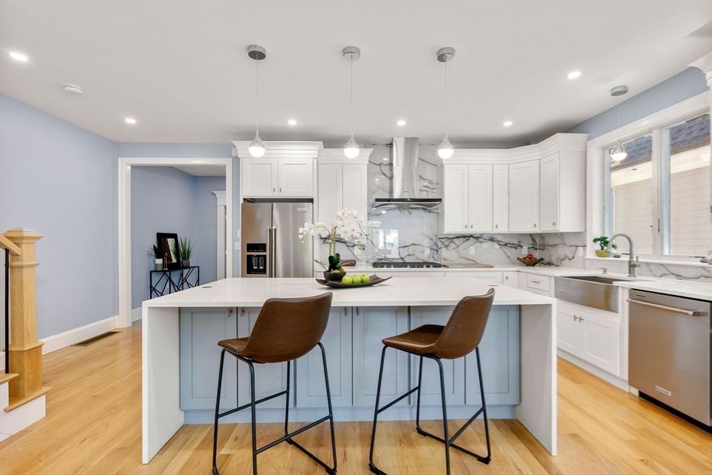 Interior, Kitchen, Marble Walls, Pendant Lights, Recessed Lighting, Stainless Steel Appliances, Wood Texture Flooring