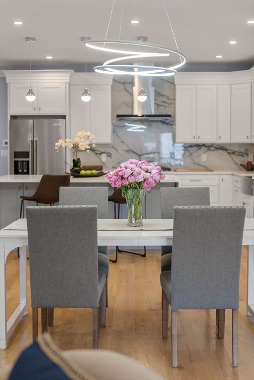 Interior, Kitchen, Marble Walls, Pendant Lights, Recessed Lighting, Stainless Steel Appliances, Wood Texture Flooring