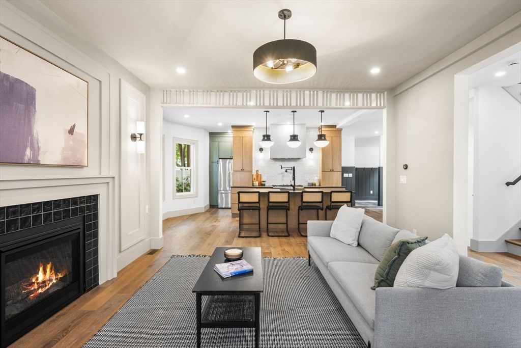 Fireplace, Interior, Kitchen, Living room, Pendant Lights, Recessed Lighting, Stainless Steel Appliances, Wood Texture Flooring