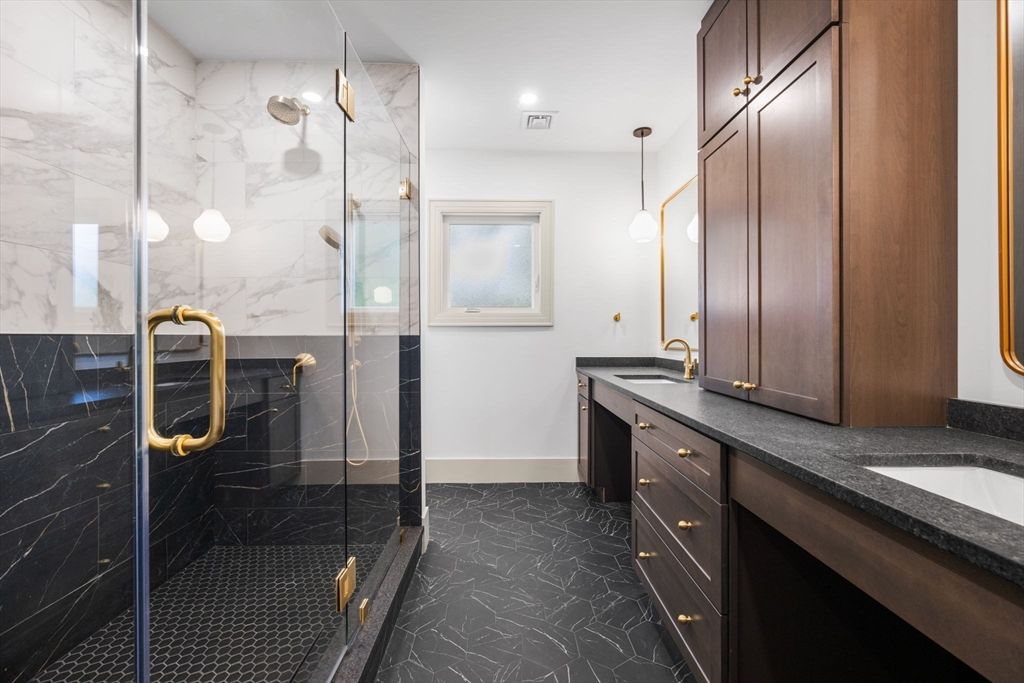 Bathroom, Dual Sink Vanities, Glass Shower, Interior, Marble Walls, Pendant Lights, Recessed Lighting