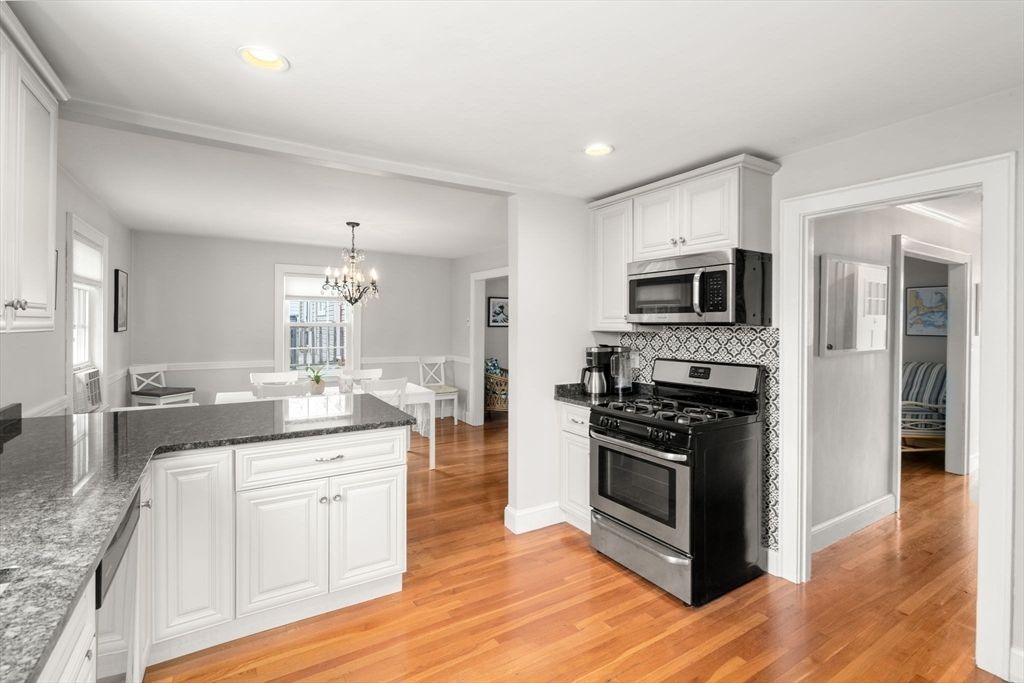 Chandelier, Dining room, Interior, Kitchen, Recessed Lighting, Stainless Steel Appliances, Wood Texture Flooring