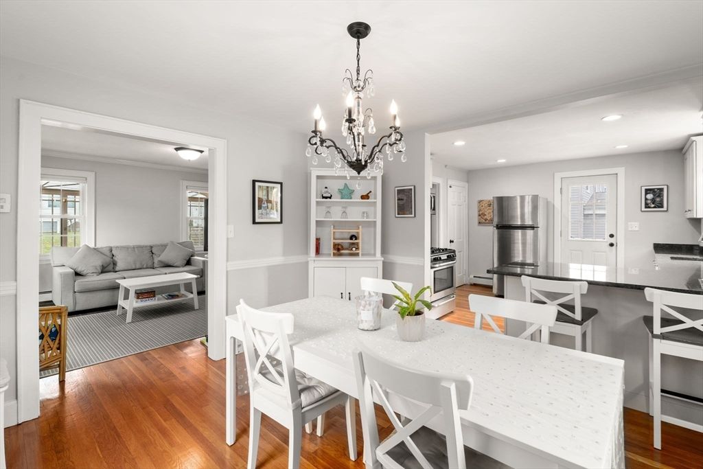 Chandelier, Dining room, Interior, Kitchen, Living room, Recessed Lighting, Stainless Steel Appliances, Wood Texture Flooring
