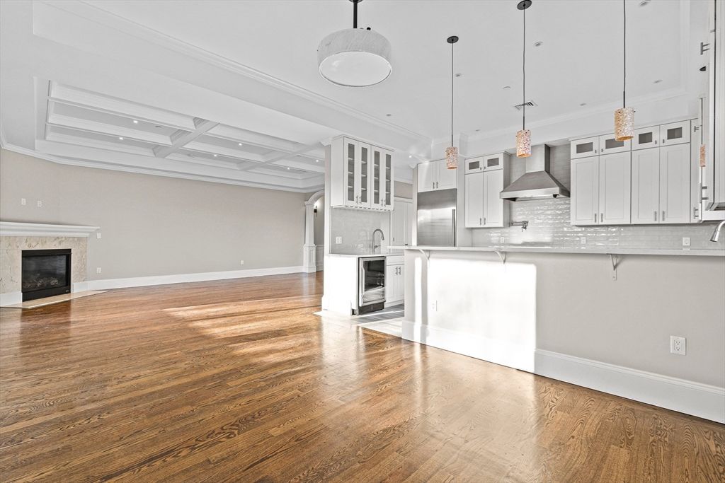 Empty room, Fireplace, Interior, Kitchen, Pendant Lights, Recessed Lighting, Wood Texture Flooring