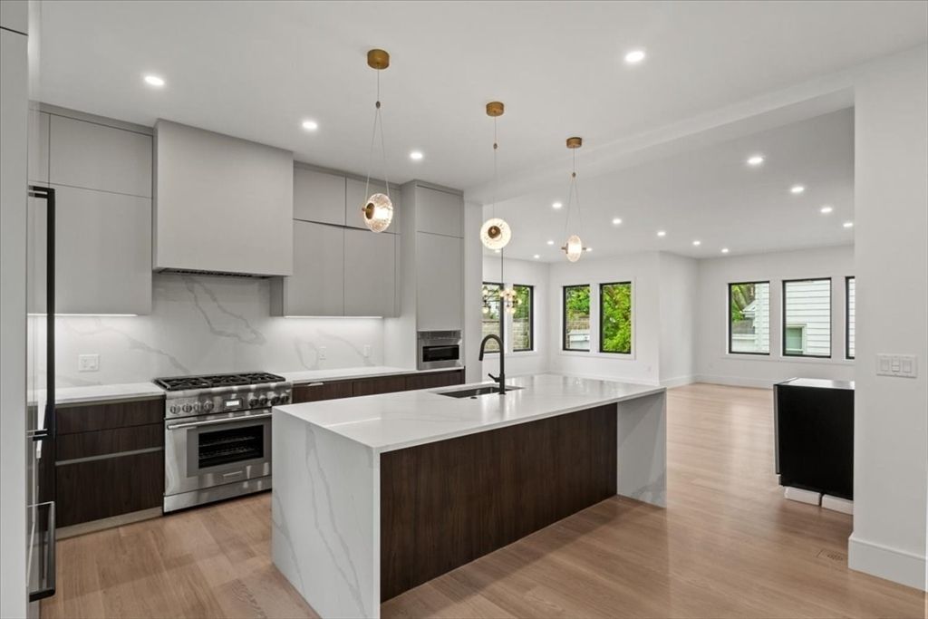 Interior, Kitchen, Marble Walls, Pendant Lights, Recessed Lighting, Stainless Steel Appliances, Wood Texture Flooring