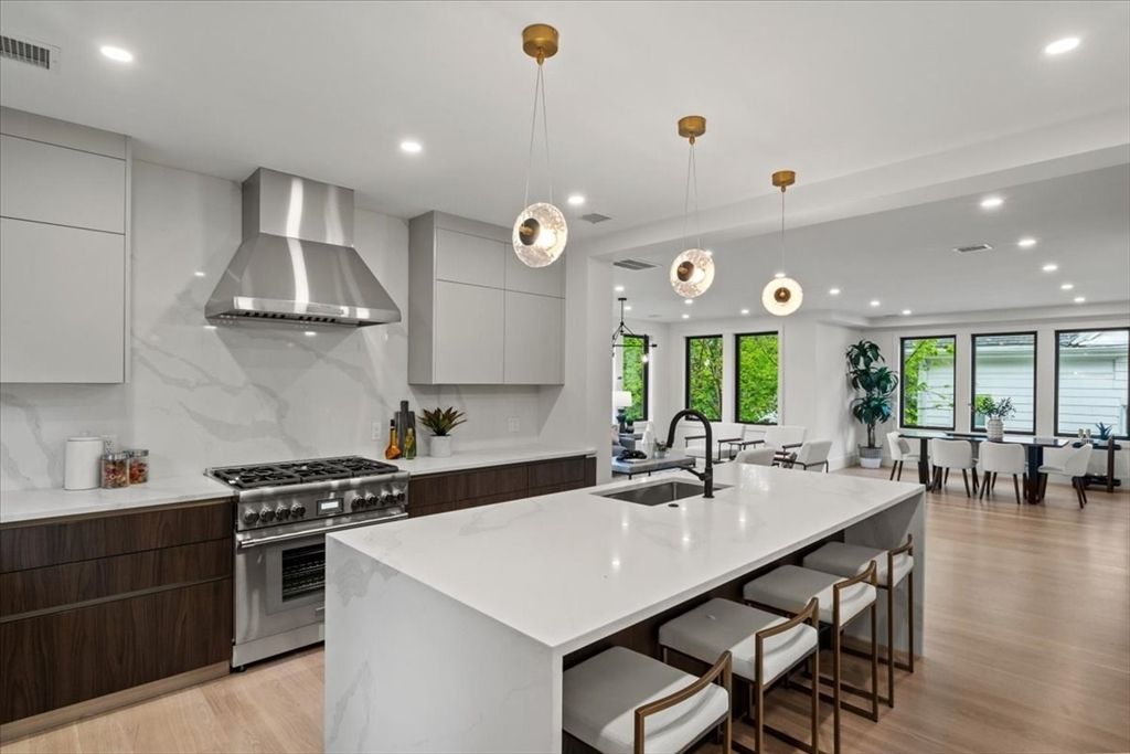 Dining room, Interior, Kitchen, Pendant Lights, Recessed Lighting, Stainless Steel Appliances, Water, Wood Texture Flooring