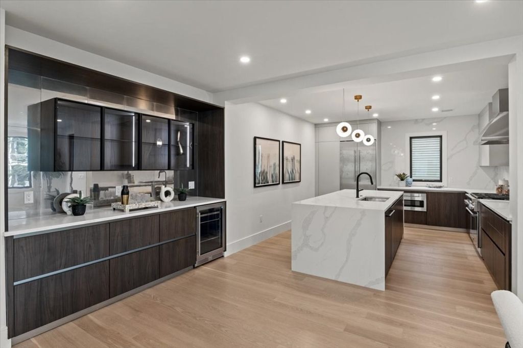 Interior, Kitchen, Marble Walls, Pendant Lights, Recessed Lighting, Stainless Steel Appliances, Wood Texture Flooring