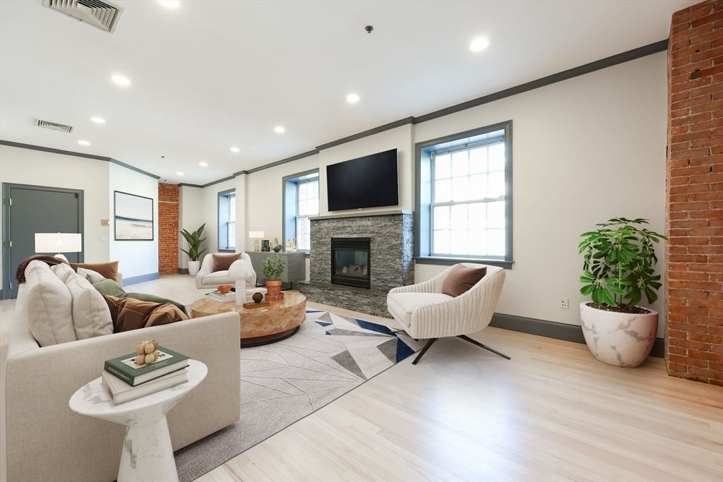 Fireplace, Interior, Living room, Recessed Lighting, Stone Walls, Wood Texture Flooring