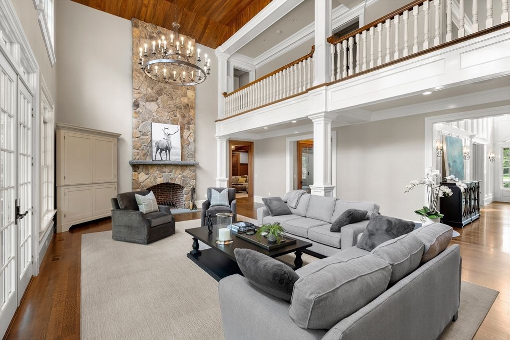 Chandelier, Fireplace, Interior, Living room, Recessed Lighting, Stone Walls, Wooden Ceilings, Wood Texture Flooring