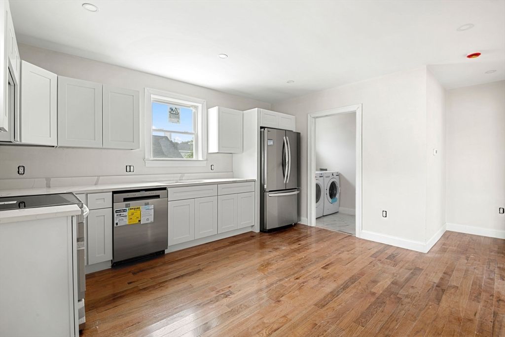 Interior, Kitchen, Recessed Lighting, Washer, Wood Texture Flooring