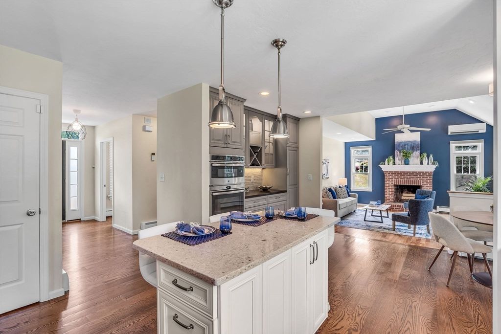 Dining room, Fireplace, Interior, Kitchen, Living room, Pendant Lights, Recessed Lighting, Stainless Steel Appliances, Wood Texture Flooring