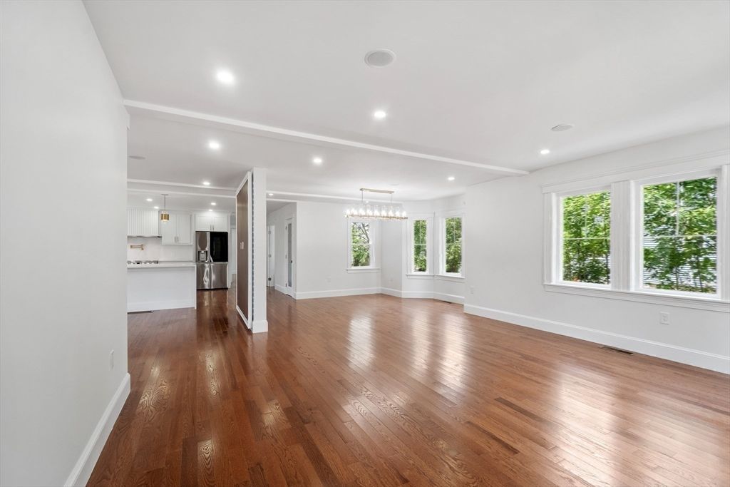 Chandelier, Empty room, Interior, Kitchen, Pendant Lights, Recessed Lighting, Stainless Steel Appliances, Wood Texture Flooring