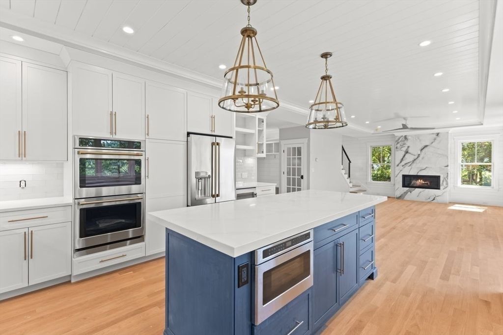 Fireplace, Interior, Kitchen, Pendant Lights, Recessed Lighting, Stainless Steel Appliances, Wood Texture Flooring