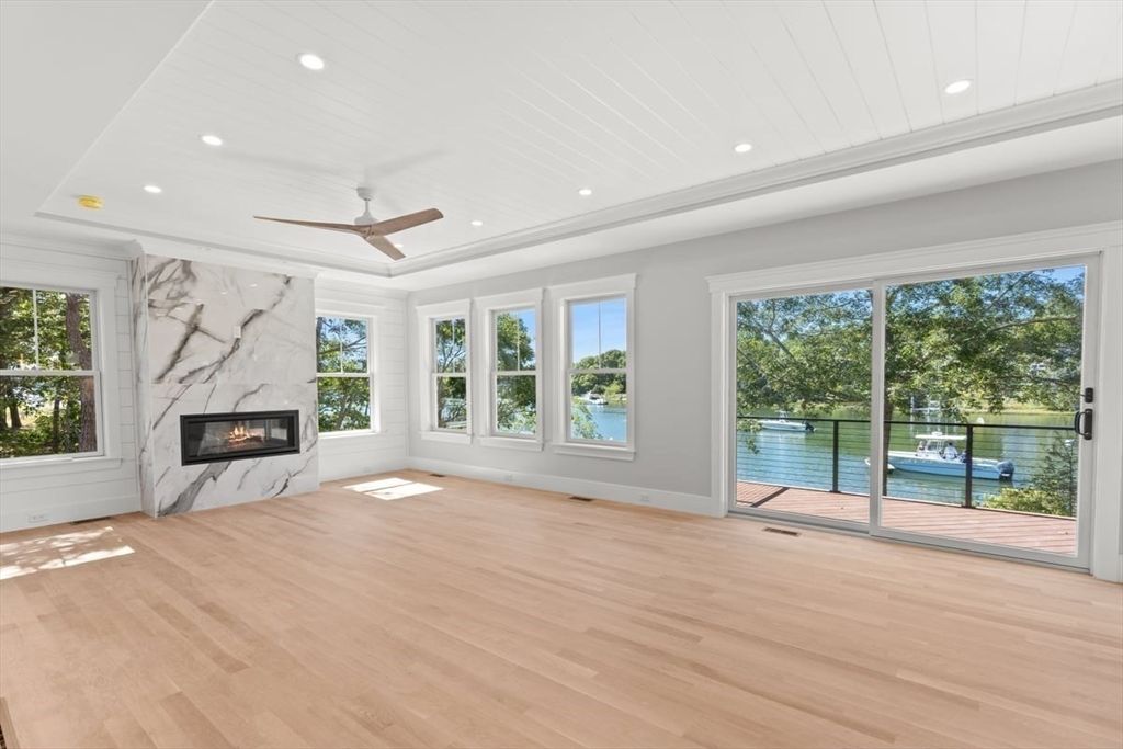 Empty room, Fireplace, Interior, Recessed Lighting, Water, Wood Texture Flooring