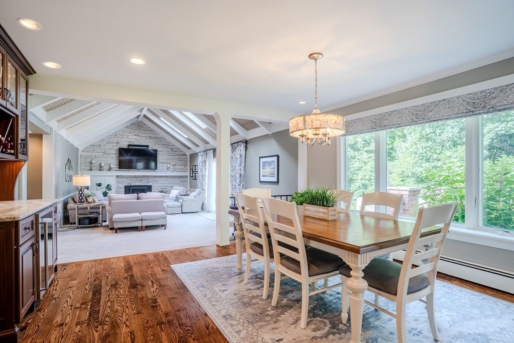 Chandelier, Dining room, Fireplace, Interior, Living room, Recessed Lighting, Stone Walls, Wood Texture Flooring