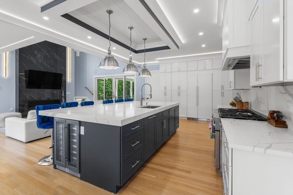 Interior, Kitchen, Marble Walls, Pendant Lights, Recessed Lighting, Stainless Steel Appliances, Wood Texture Flooring