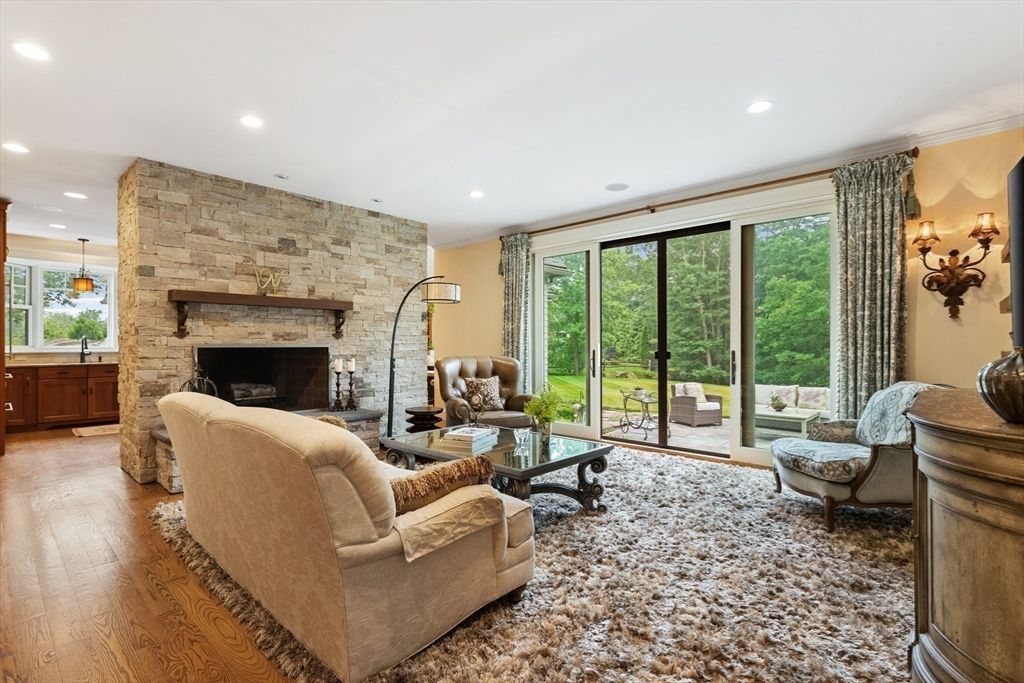 Fireplace, Interior, Living room, Recessed Lighting, Stone Walls, Wood Texture Flooring