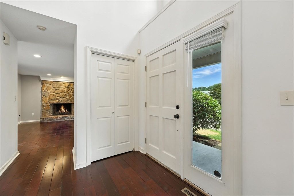 Empty room, Fireplace, Interior, Recessed Lighting, Stone Walls, Wood Texture Flooring