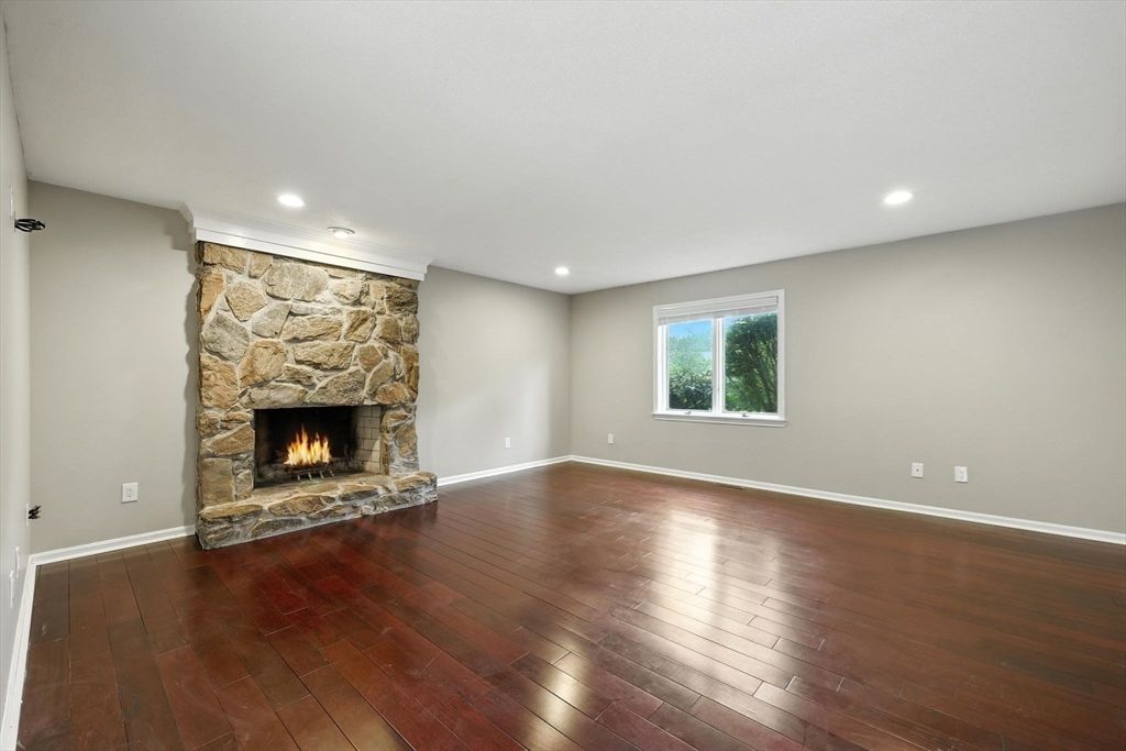 Empty room, Fireplace, Interior, Recessed Lighting, Stone Walls, Wood Texture Flooring