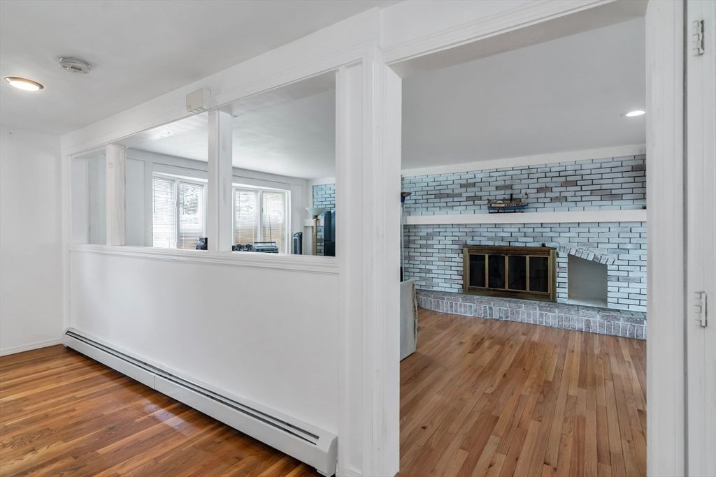 Empty room, Fireplace, Interior, Recessed Lighting, Stone Walls, Wood Texture Flooring
