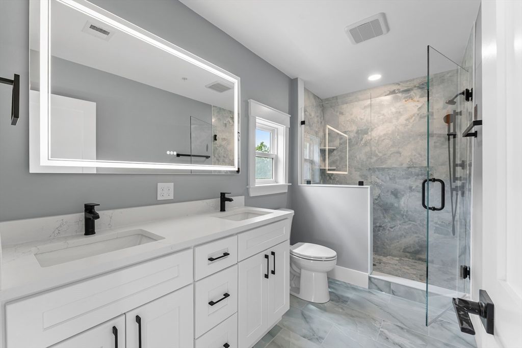 Bathroom, Dual Sink Vanities, Glass Shower, Interior, Marble, Marble Walls, Recessed Lighting