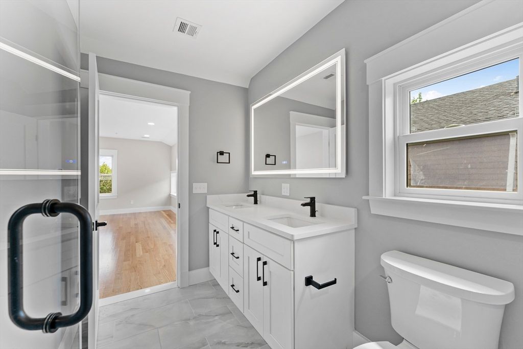 Bathroom, Dual Sink Vanities, Interior, Marble, Recessed Lighting, Wood Texture Flooring