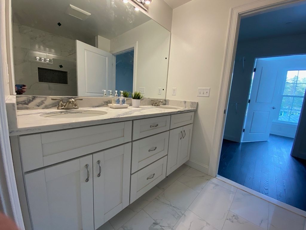 Bathroom, Dual Sink Vanities, Interior, Marble, Marble Walls, Wood Texture Flooring