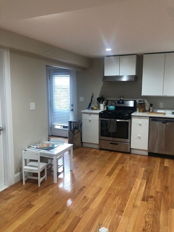 Dining room, Interior, Kitchen, Recessed Lighting, Stainless Steel Appliances, Wood Texture Flooring