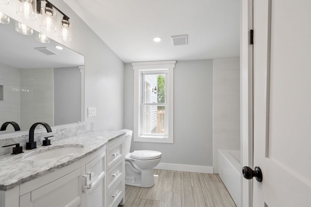 Bathroom, Dual Sink Vanities, Interior, Recessed Lighting, Wood Texture Flooring