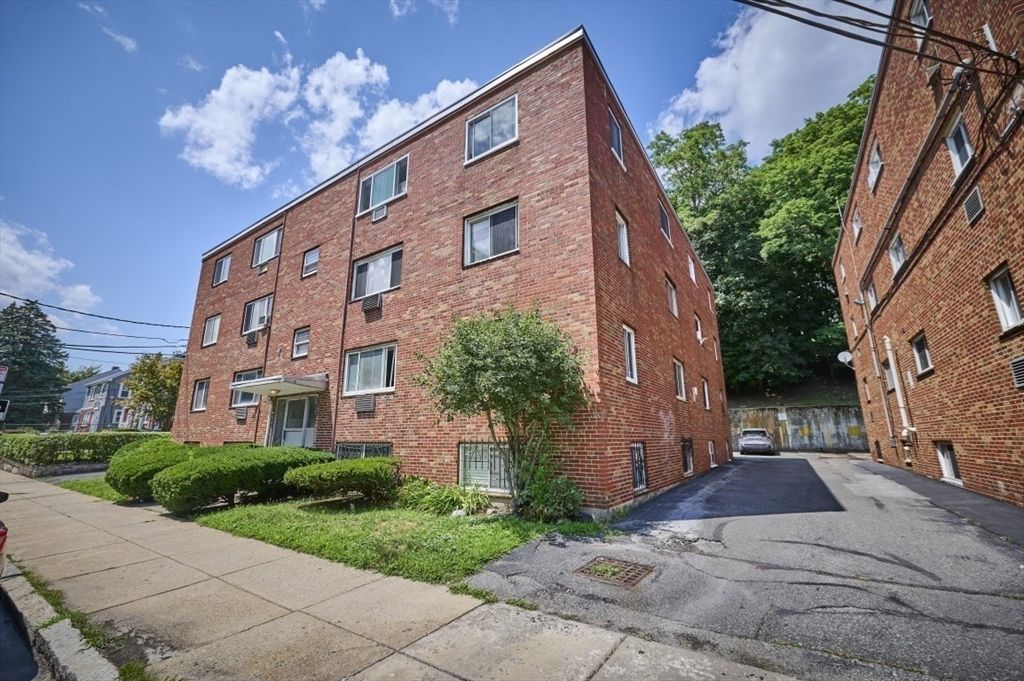 Exterior, Facade, Brick Facade, Condo Building